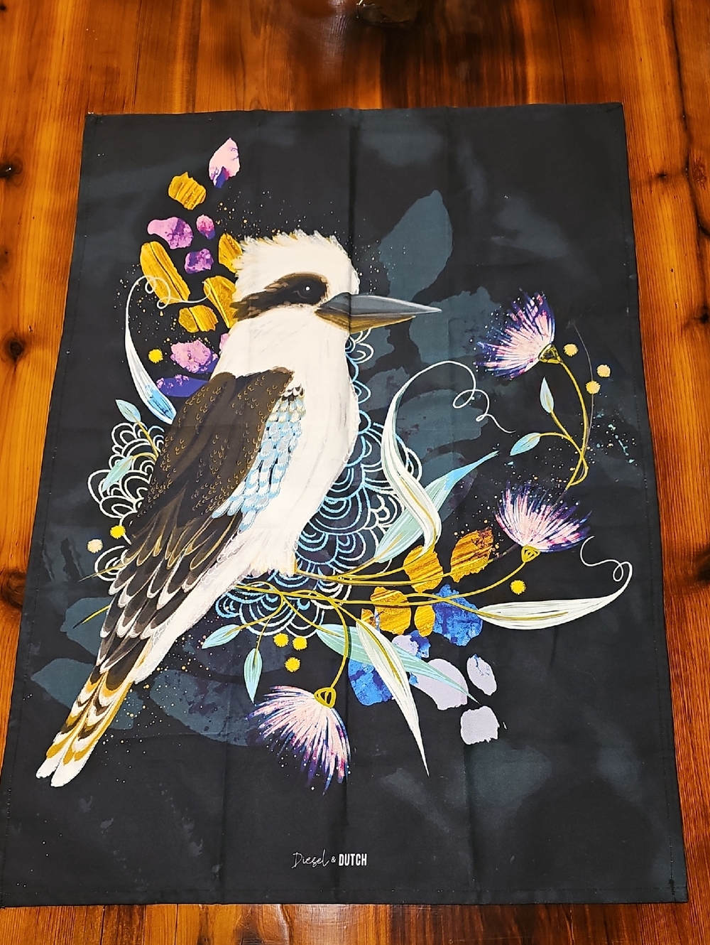 Kookaburra Graphic Tea Towel with Floral Accents - Black Background